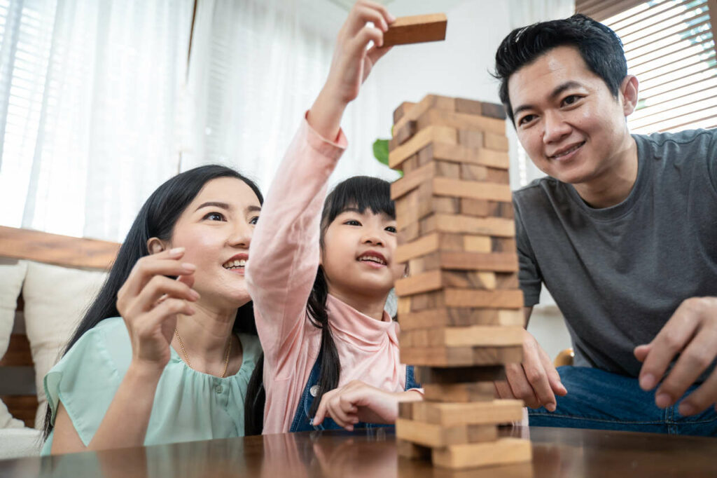 parents are playing with their kid