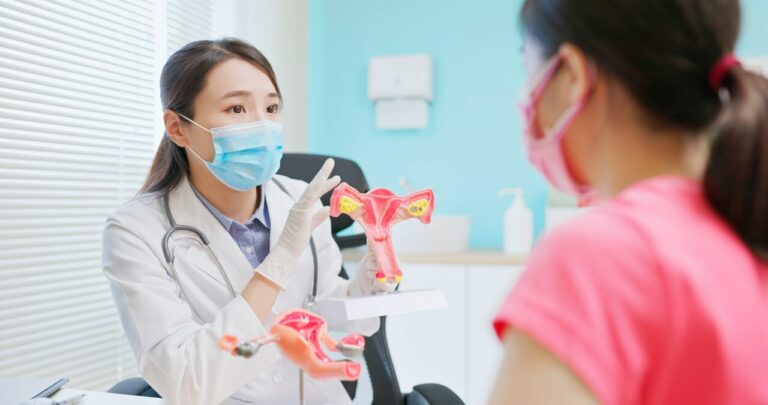 a woman discussing with a doctor about cervical cancer